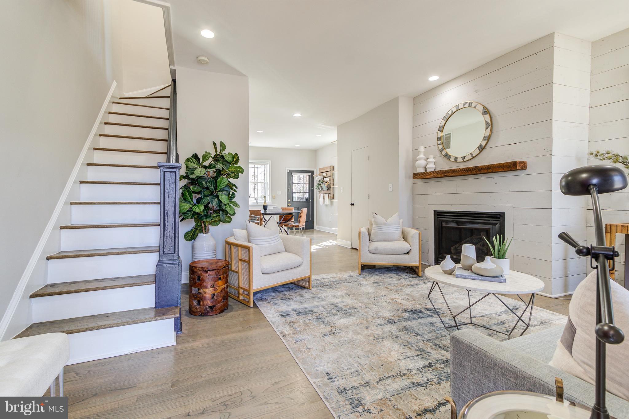 344 14th Street Southeast Washington, DC 20003 - Photo 4 of 31 a living room with furniture and a fireplace
