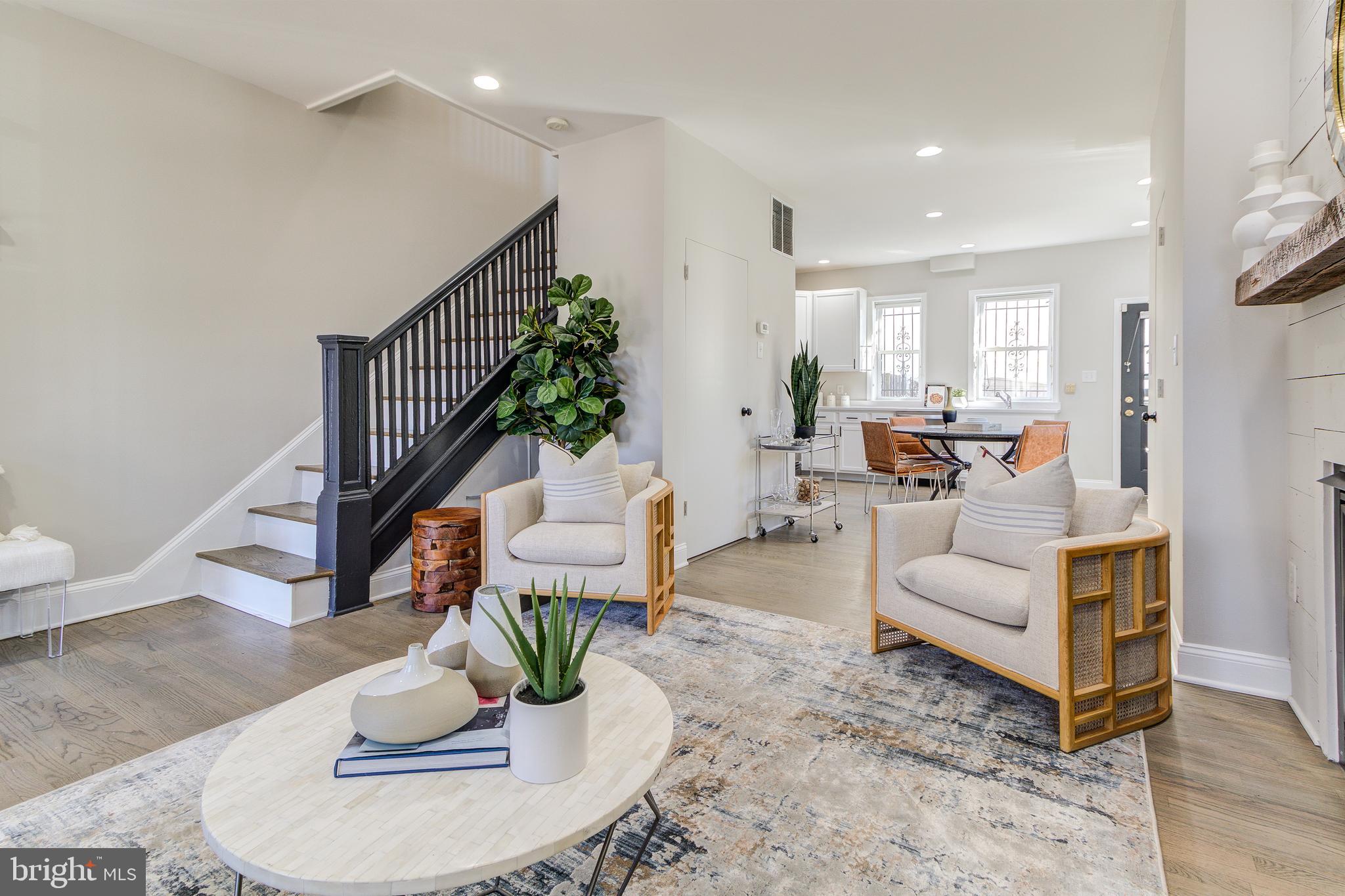344 14th Street Southeast Washington, DC 20003 - Photo 5 of 31 a living room with furniture or couch and a dining table