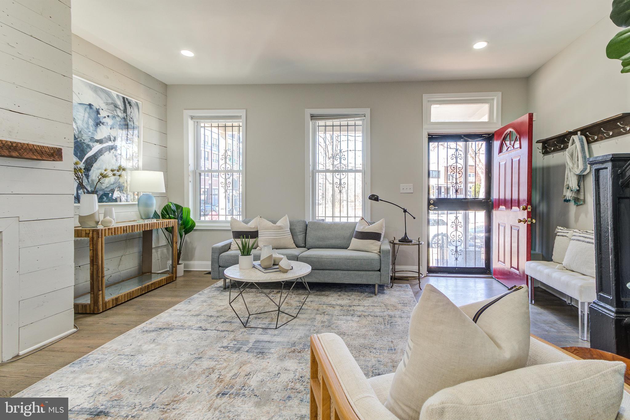 344 14th Street Southeast Washington, DC 20003 - Photo 6 of 31 a living room with furniture fireplace and a large window