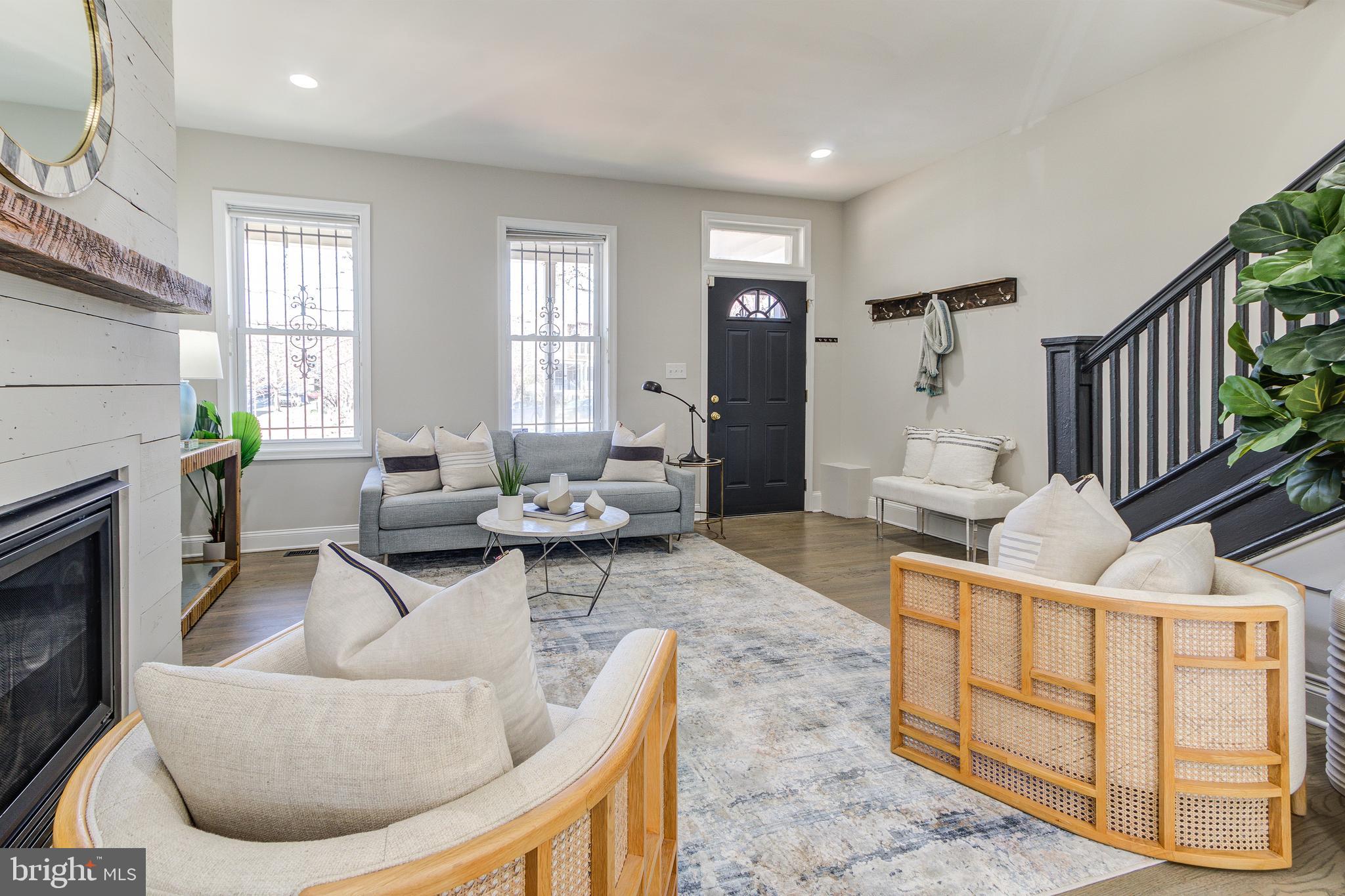 344 14th Street Southeast Washington, DC 20003 - Photo 7 of 31 a living room with furniture windows and a fireplace