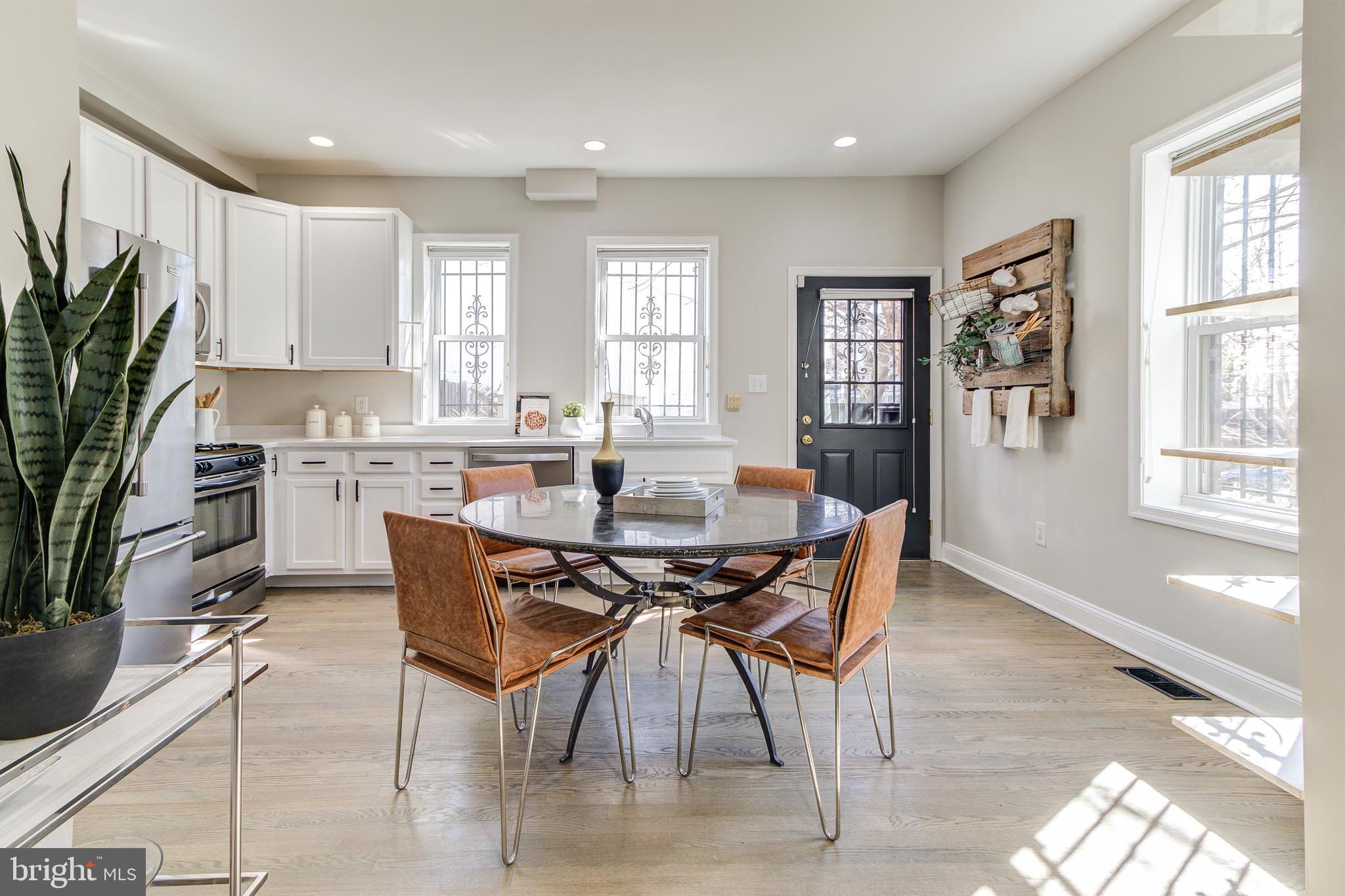 344 14th Street Southeast Washington, DC 20003 - Photo 8 of 31 a view of a dining room with furniture and a potted plant