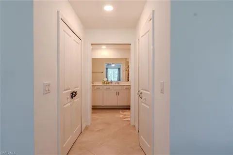a view of a bathroom from a hallway