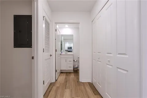 a view of a bathroom from a hallway