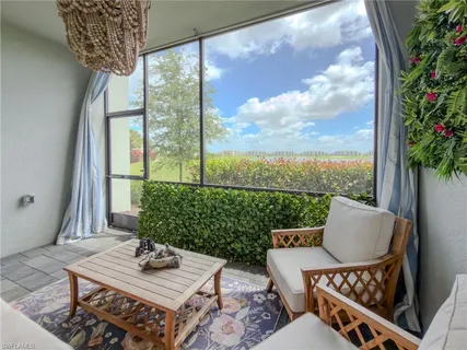 a view of an outdoor sitting area with furniture