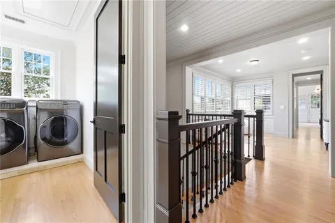 a view of a hallway with washer and dryer