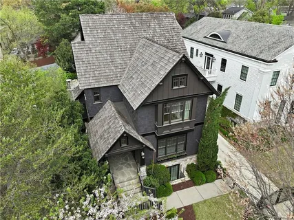 a aerial view of a house with a yard