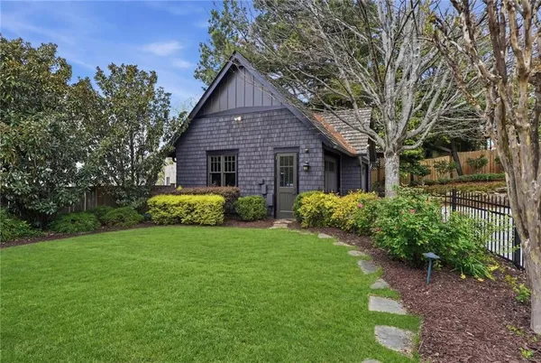 a backyard of a house with lots of green space