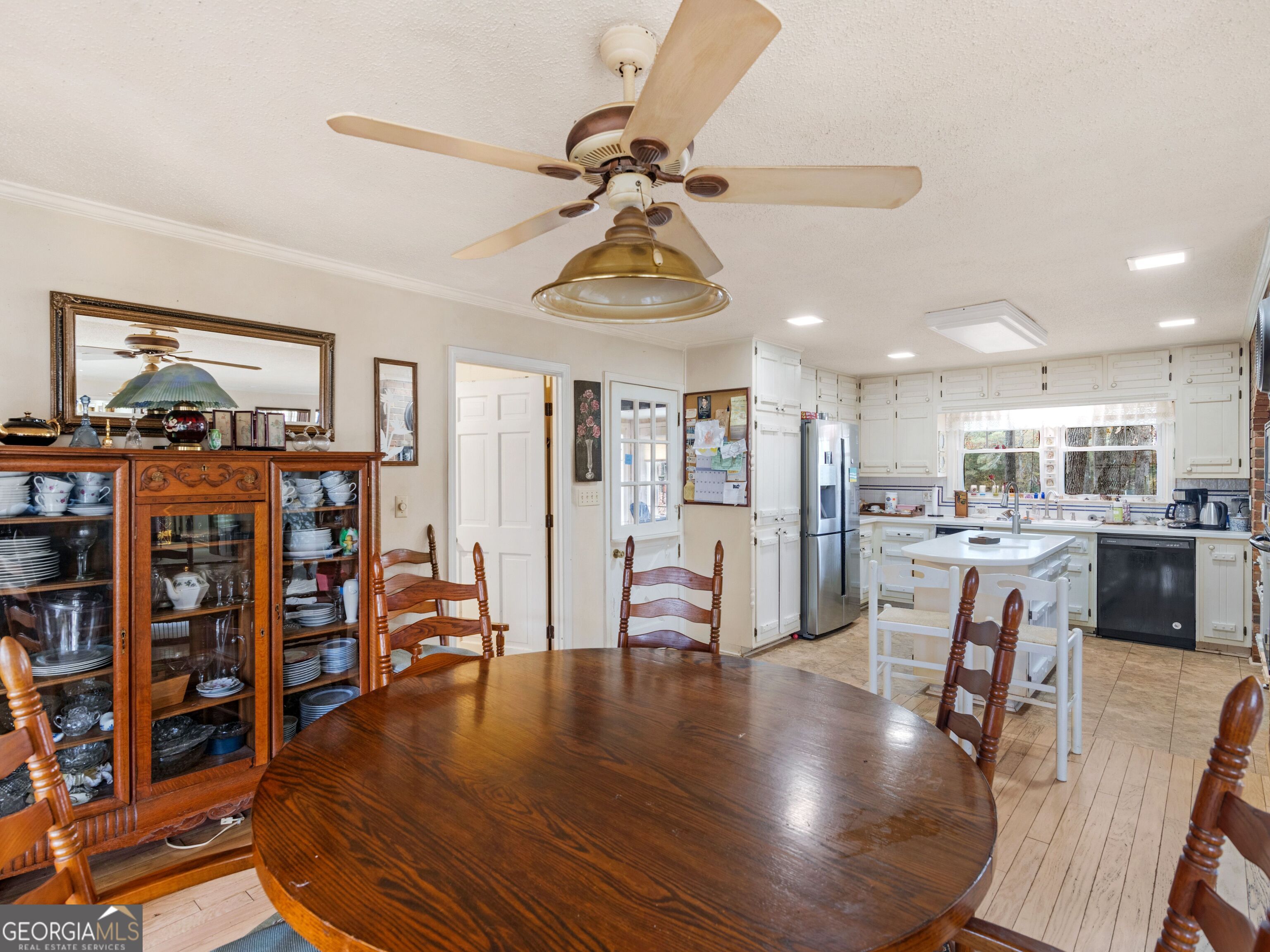 879 Rocky Creek Road Hampton, GA 30228 - Photo 12 of 29 a living room with lots of furniture and kitchen view