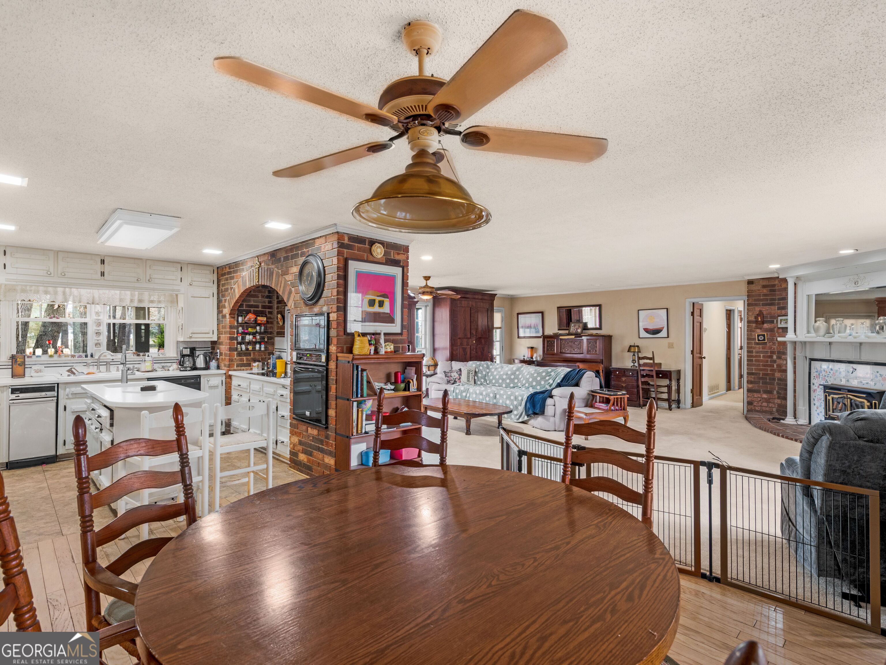 879 Rocky Creek Road Hampton, GA 30228 - Photo 13 of 29 a living room with lots of furniture and a chandelier