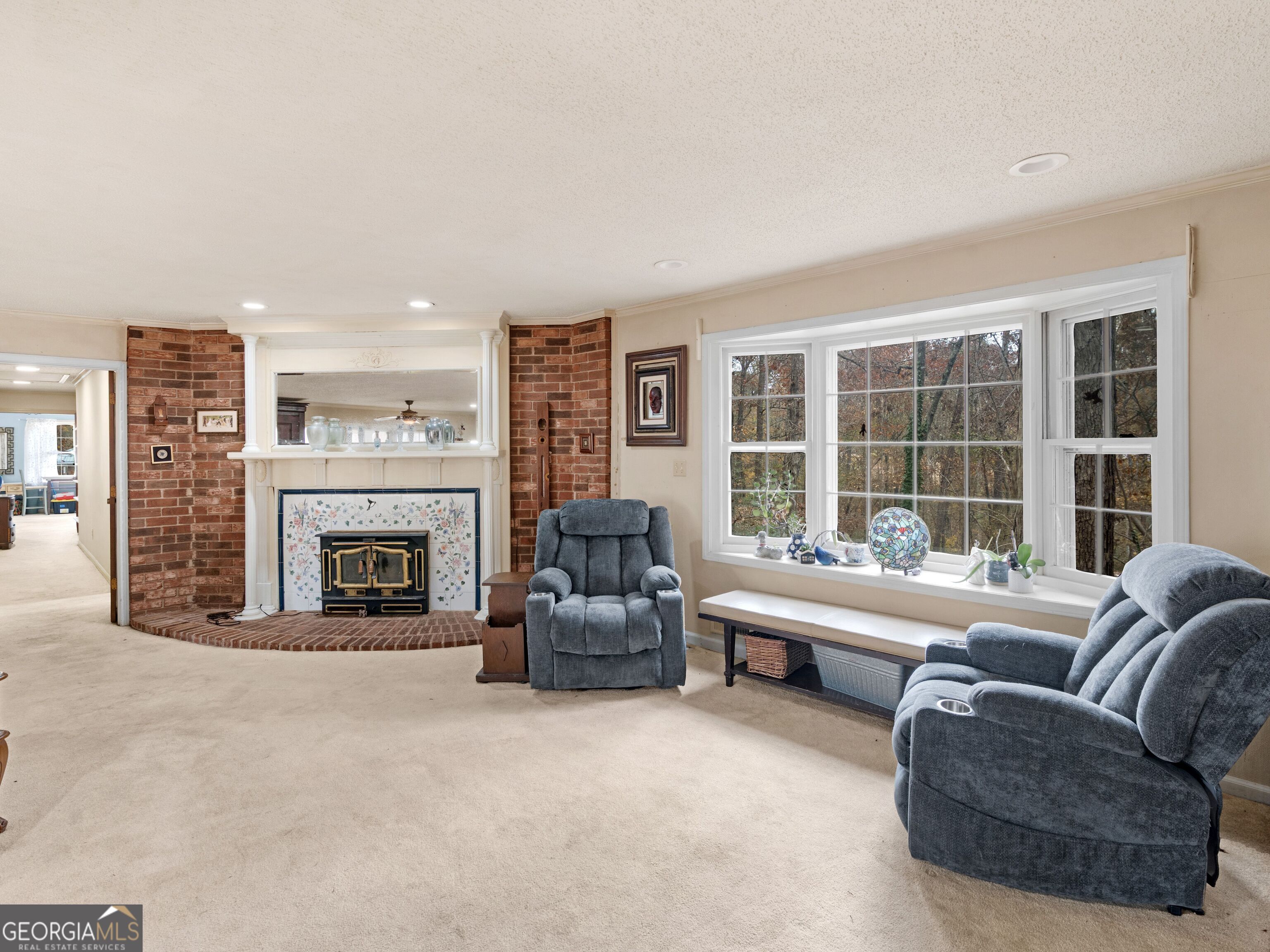 879 Rocky Creek Road Hampton, GA 30228 - Photo 14 of 29 a living room with furniture and a fireplace