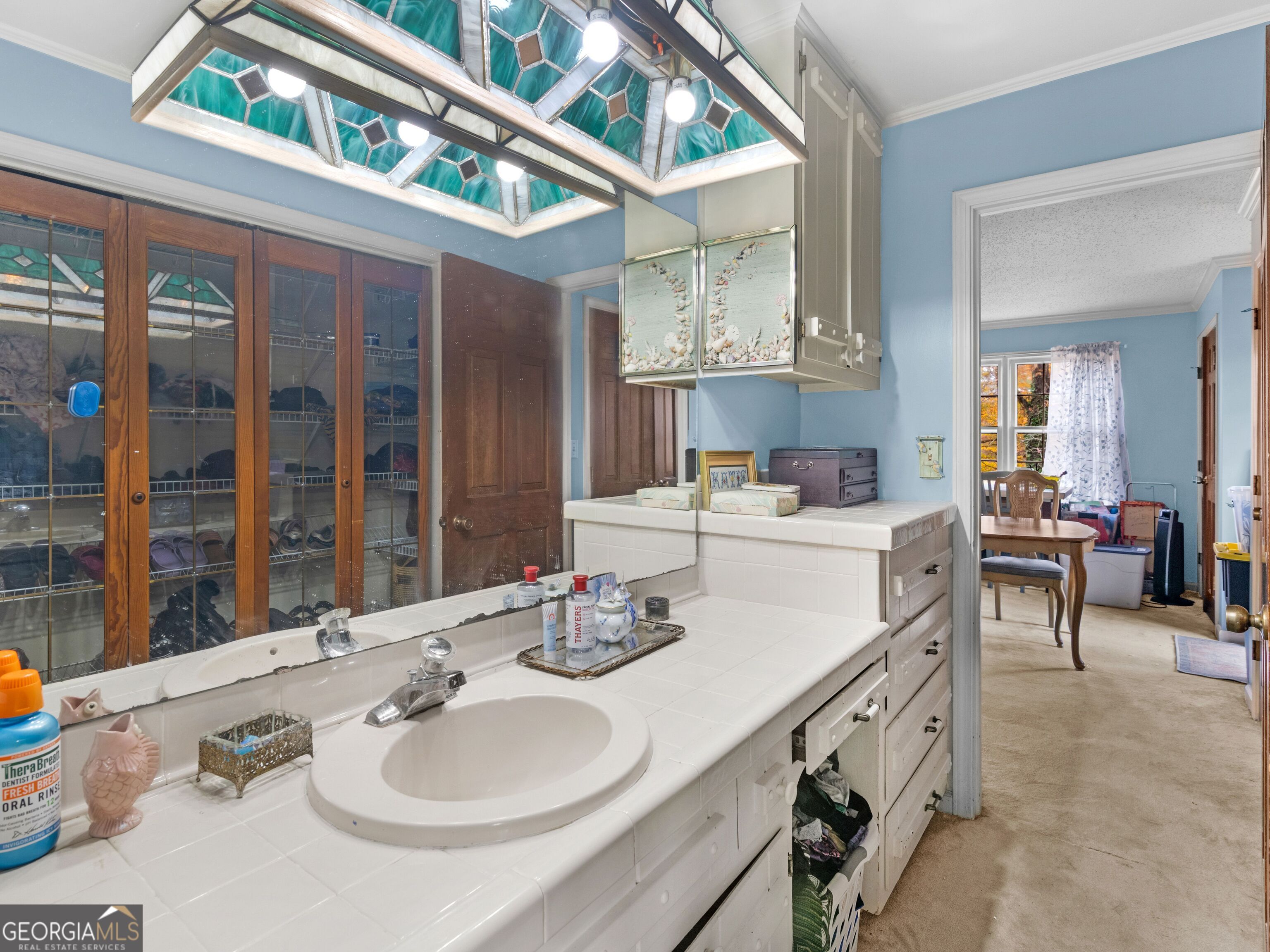 879 Rocky Creek Road Hampton, GA 30228 - Photo 25 of 29 a bathroom with a sink double vanity and a mirror