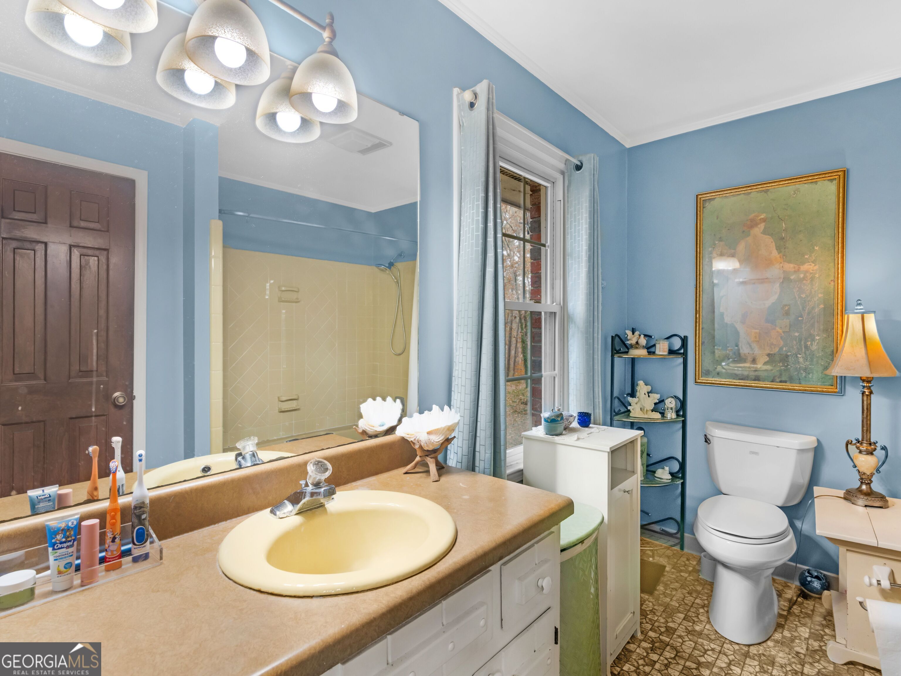 879 Rocky Creek Road Hampton, GA 30228 - Photo 26 of 29 a bathroom with a sink double vanity and a mirror