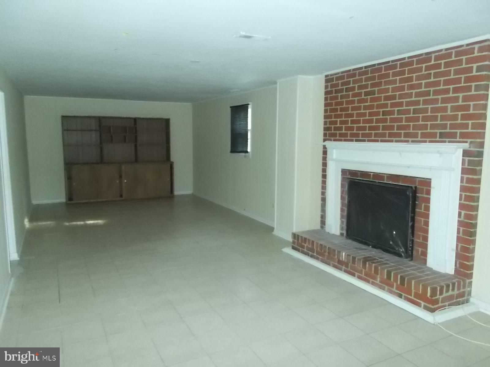 1317 Turret Road Bel Air, MD 21015 - Photo 11 of 14 a living room with a fireplace