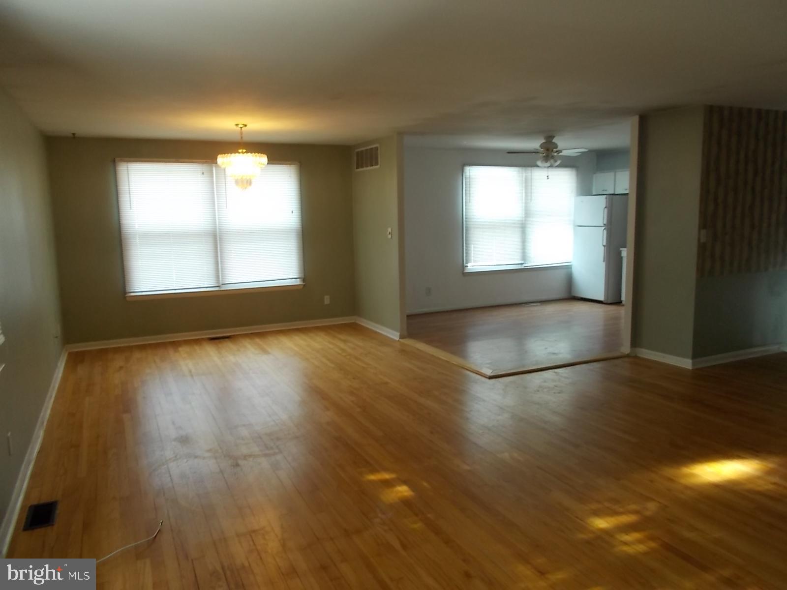 1317 Turret Road Bel Air, MD 21015 - Photo 4 of 14 an empty room with wooden floor and windows