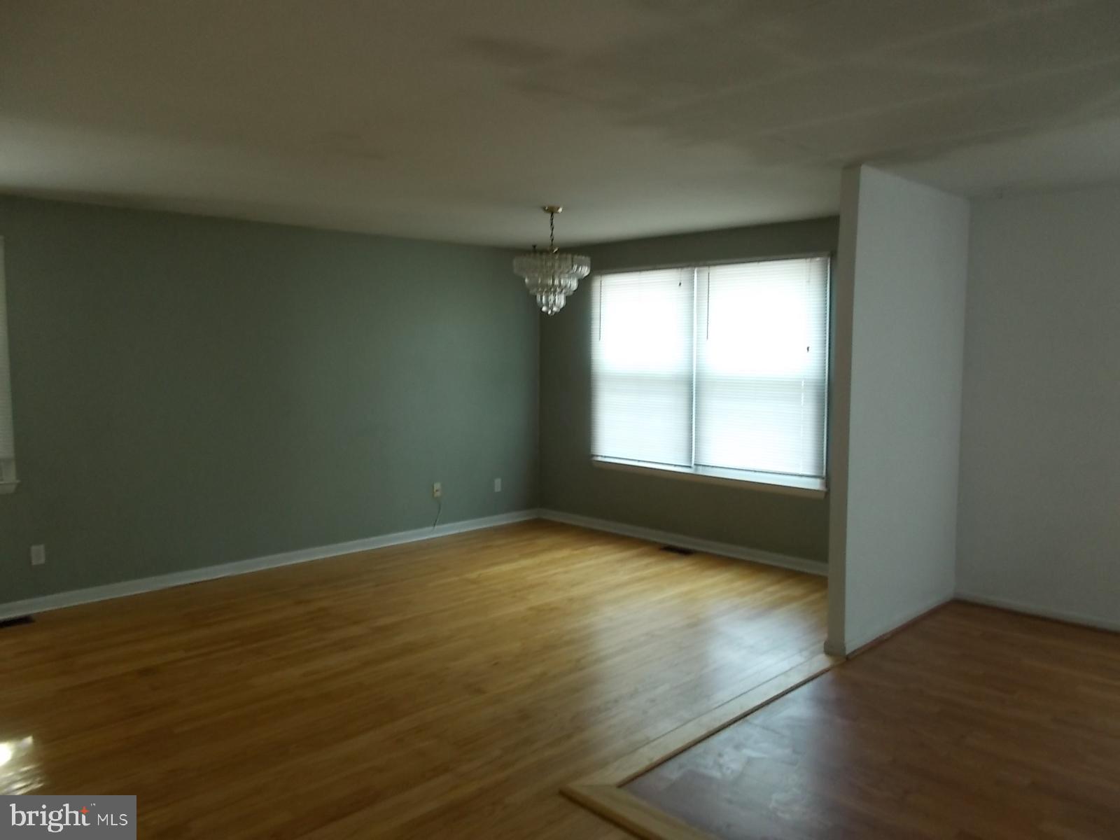 1317 Turret Road Bel Air, MD 21015 - Photo 5 of 14 an empty room with wooden floor and windows