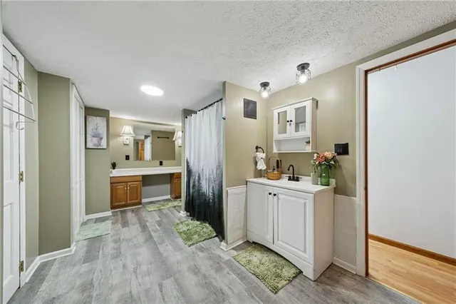 a kitchen with stainless steel appliances a refrigerator and a stove top oven