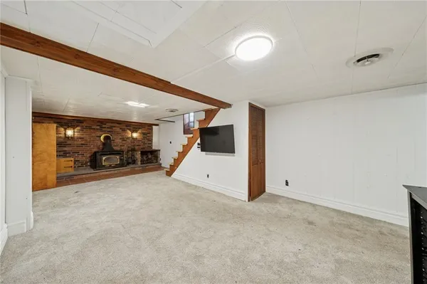 a view of a livingroom with car parked