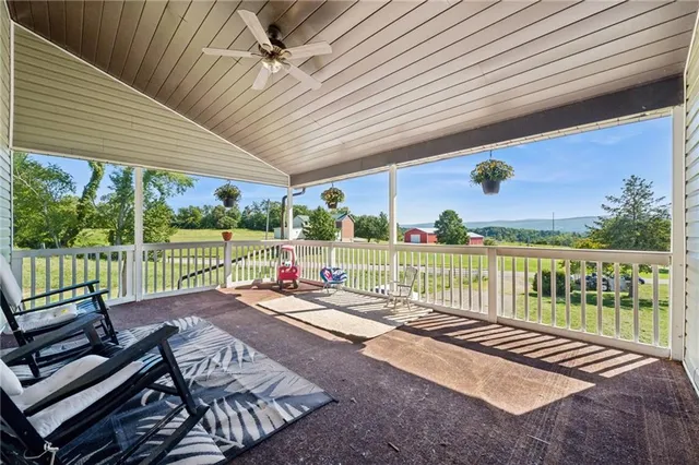 a view of a patio with wooden floor