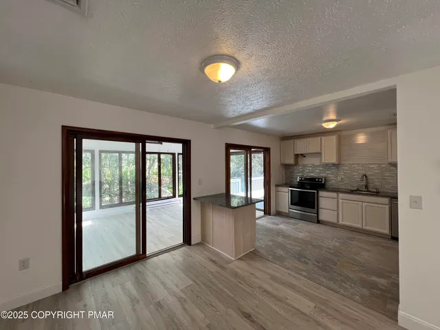 a view of large windows in a kitchen
