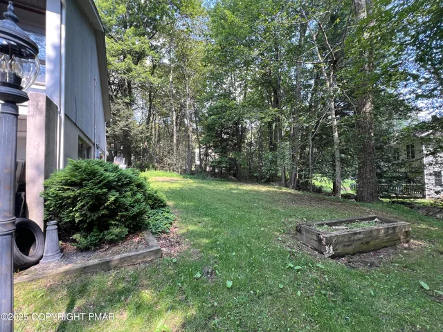 a view of a backyard with a garden