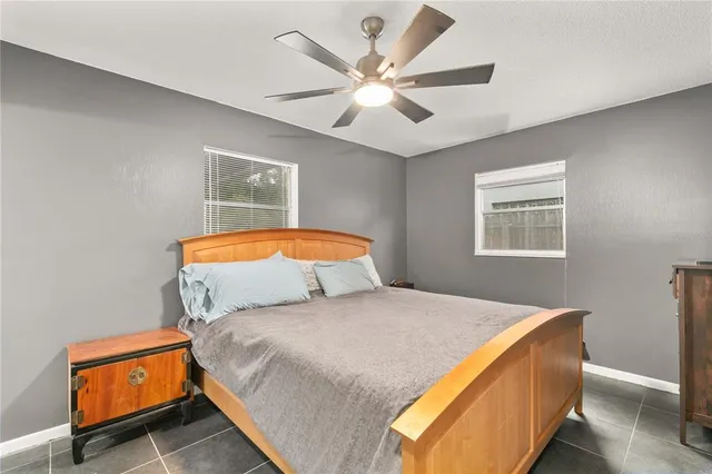 a bedroom with bed and window