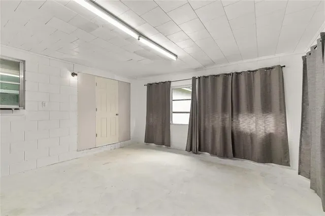 a view of a room with windows