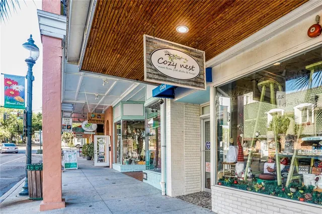 a bunch of street signs outside the stores