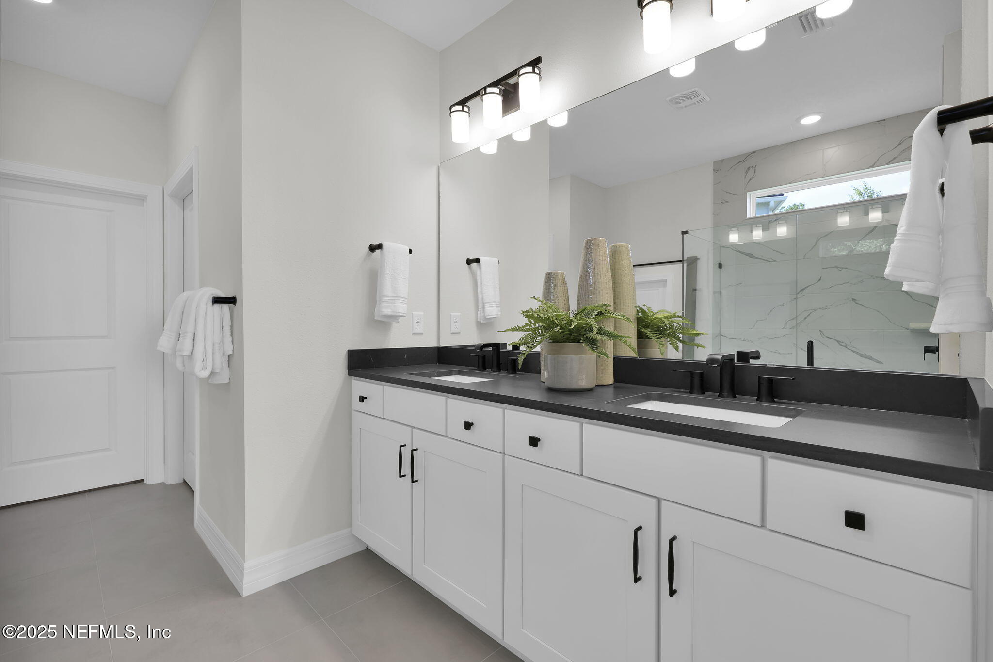 168 Coordinate Lane St. Johns, FL 32259 - Photo 13 of 22 a bathroom with double sink and a mirror