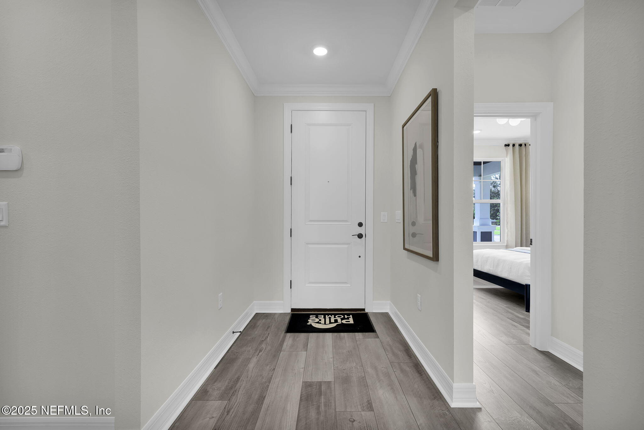 168 Coordinate Lane St. Johns, FL 32259 - Photo 3 of 22 a view of a hallway view with wooden floor and staircase