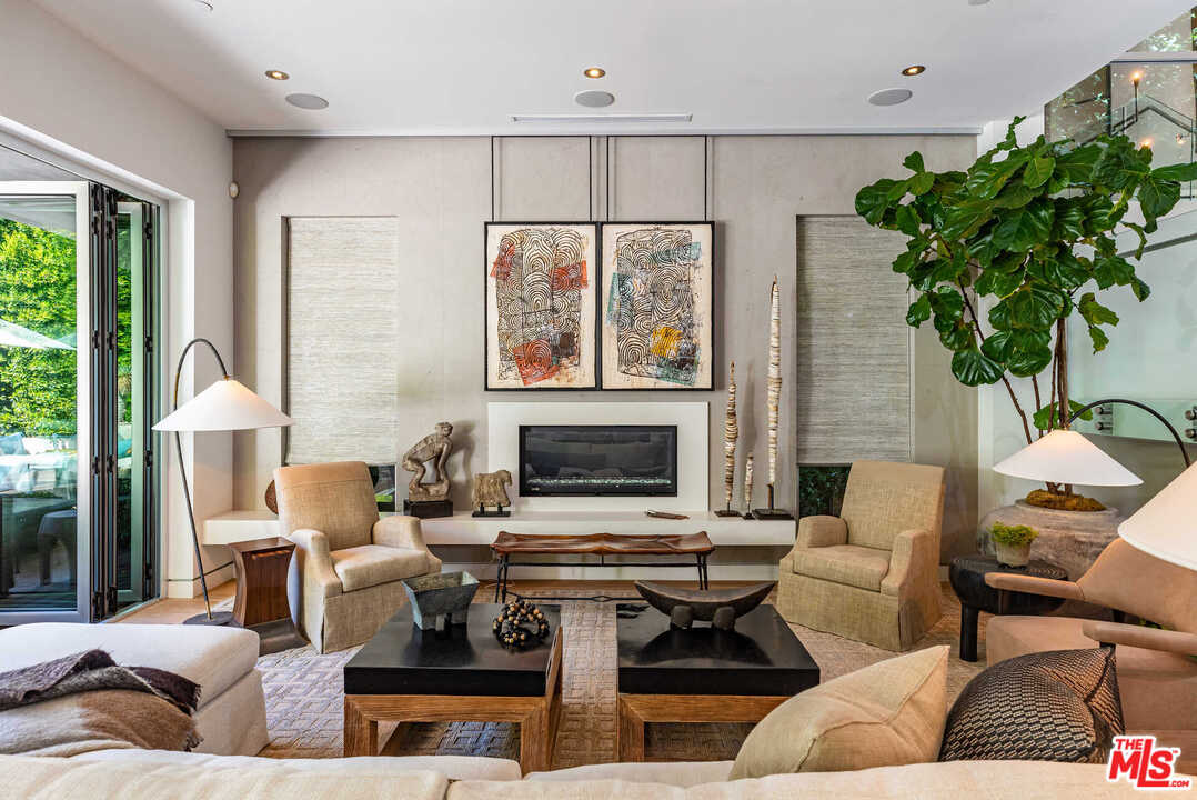 6236 Drexel Avenue Los Angeles, CA 90048 - Photo 11 of 33 a living room with furniture flower pot and a fireplace