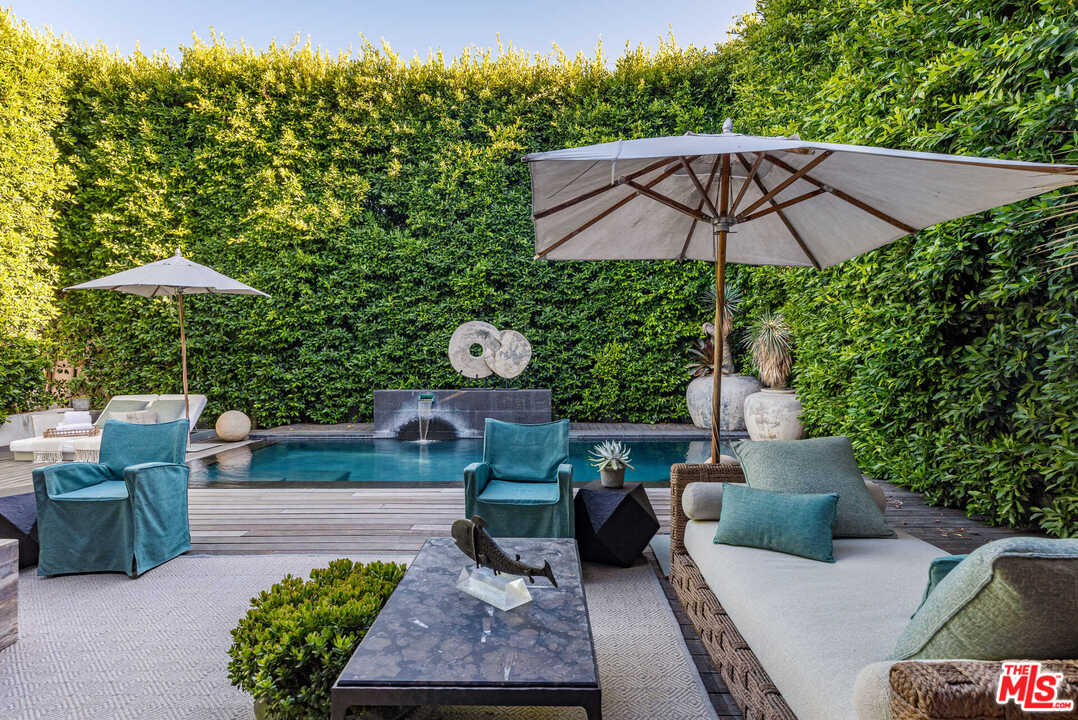 6236 Drexel Avenue Los Angeles, CA 90048 - Photo 18 of 33 a view of a backyard with furniture and a small yard