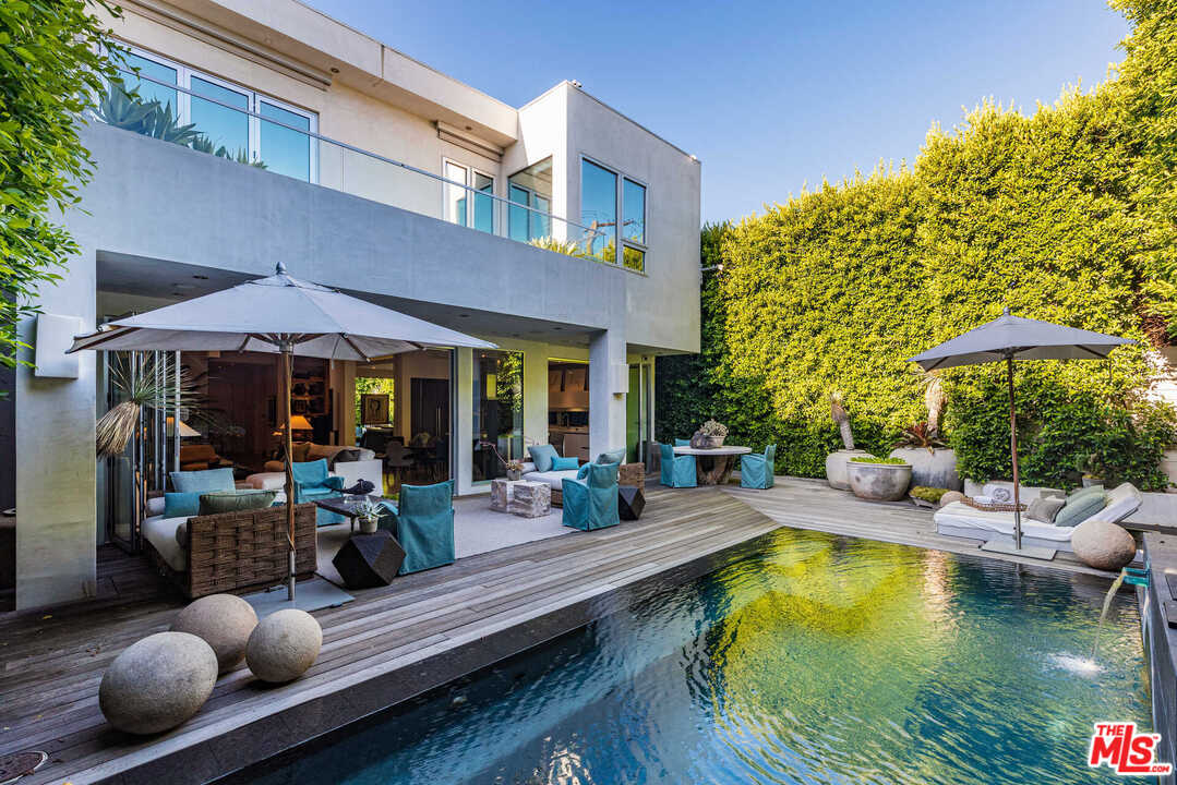 6236 Drexel Avenue Los Angeles, CA 90048 - Photo 20 of 33 a view of swimming pool with outdoor seating and plants