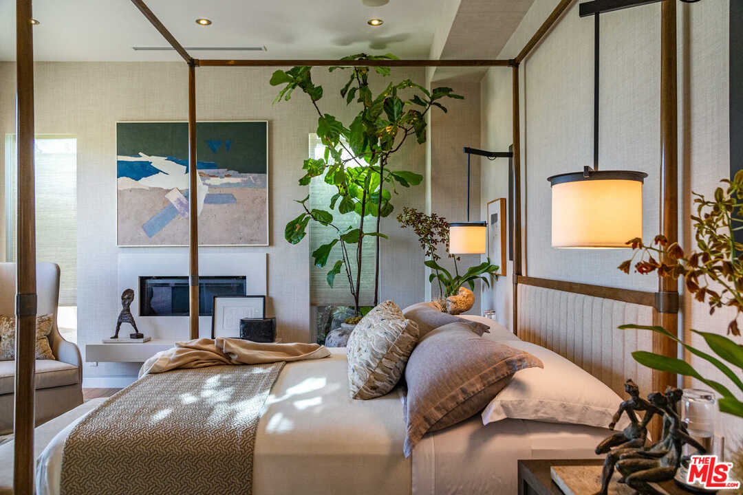 6236 Drexel Avenue Los Angeles, CA 90048 - Photo 24 of 33 a bedroom with bed and a potted plant