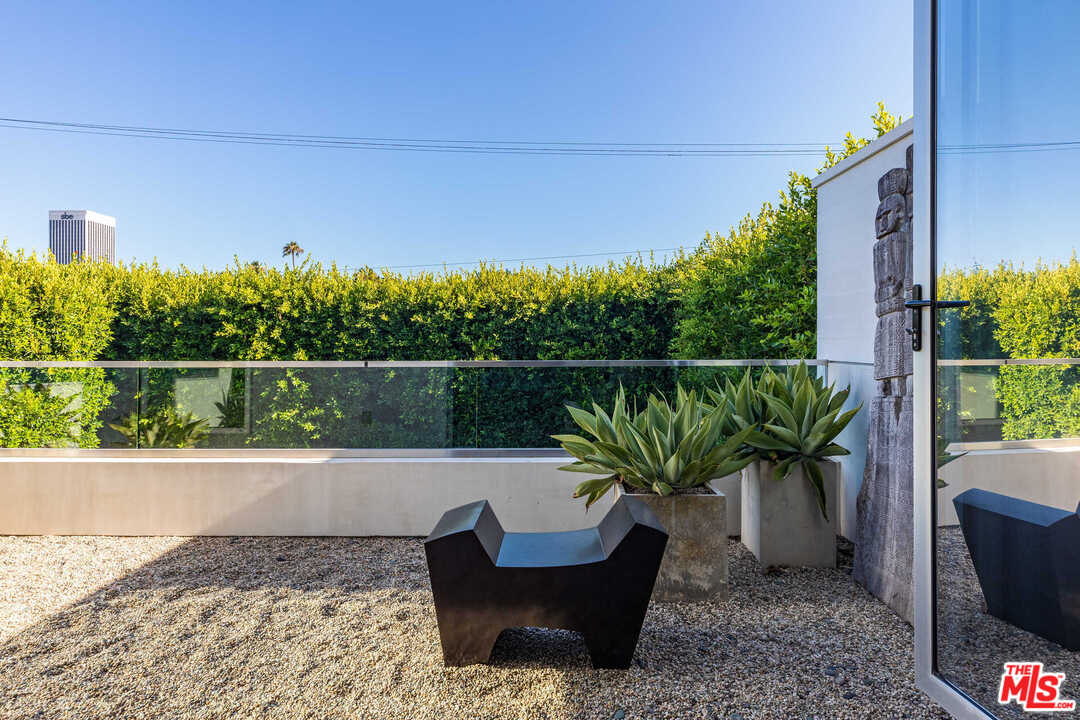 6236 Drexel Avenue Los Angeles, CA 90048 - Photo 26 of 33 a view of a chair and potted on the side of a road
