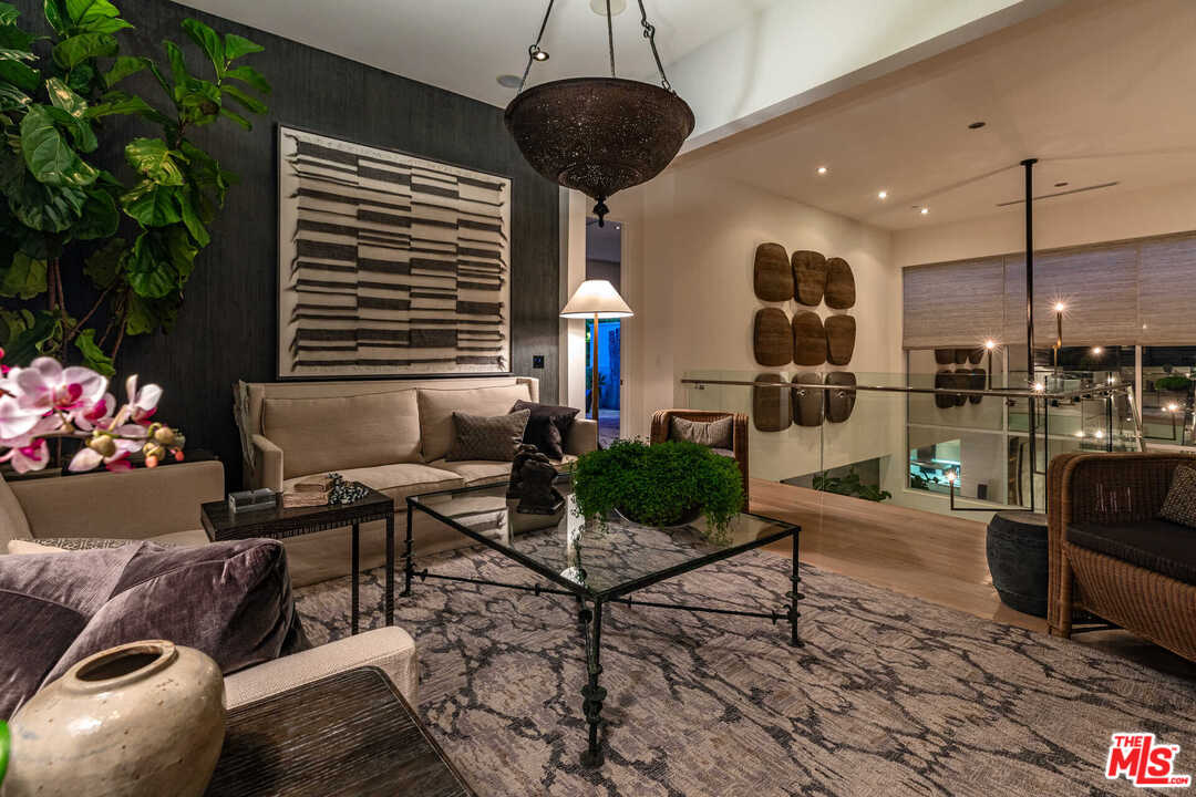 6236 Drexel Avenue Los Angeles, CA 90048 - Photo 30 of 33 a living room with furniture and a chandelier