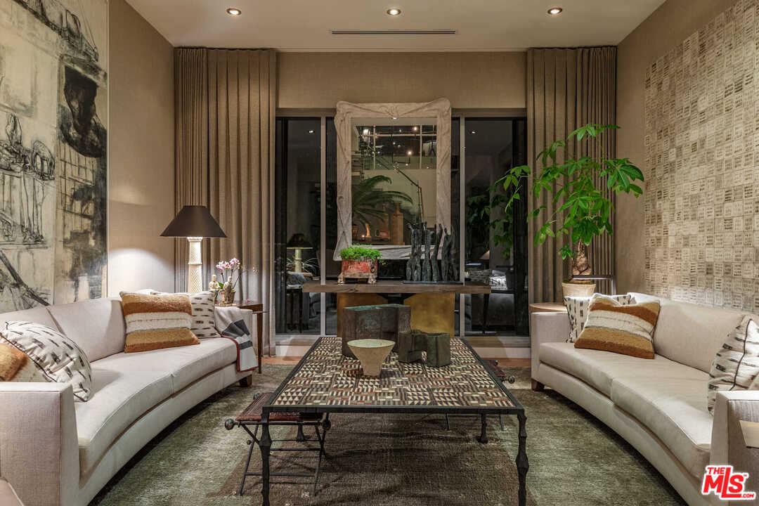 6236 Drexel Avenue Los Angeles, CA 90048 - Photo 31 of 33 a living room with furniture and a potted plant