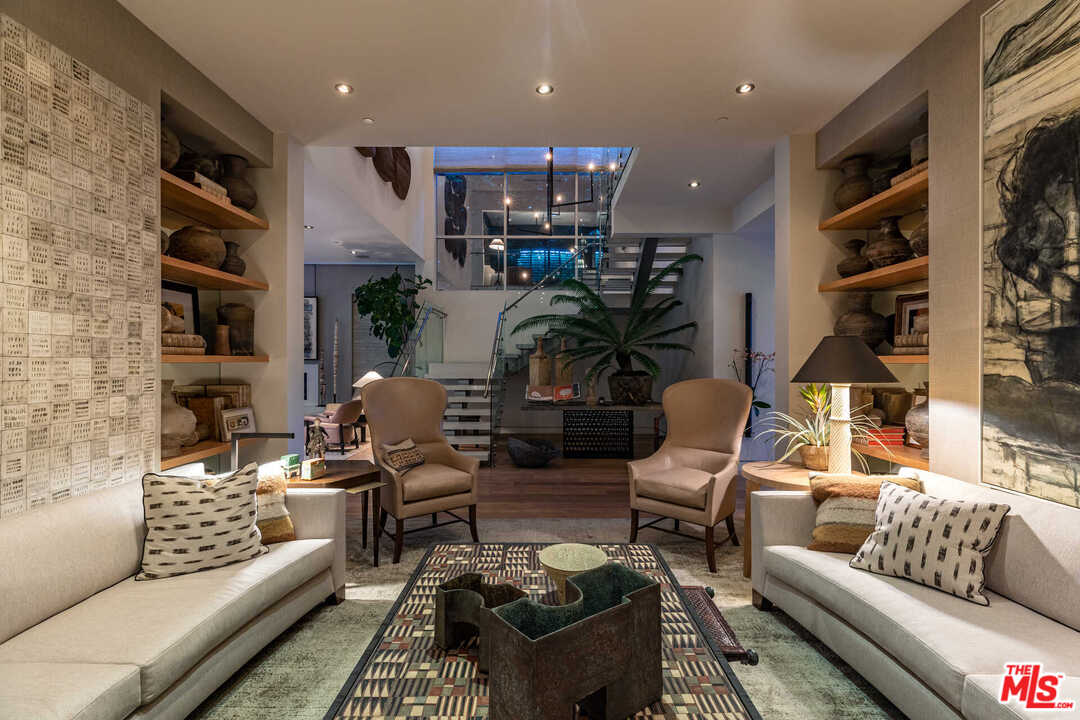 6236 Drexel Avenue Los Angeles, CA 90048 - Photo 32 of 33 a living room with furniture fireplace and a flat screen tv