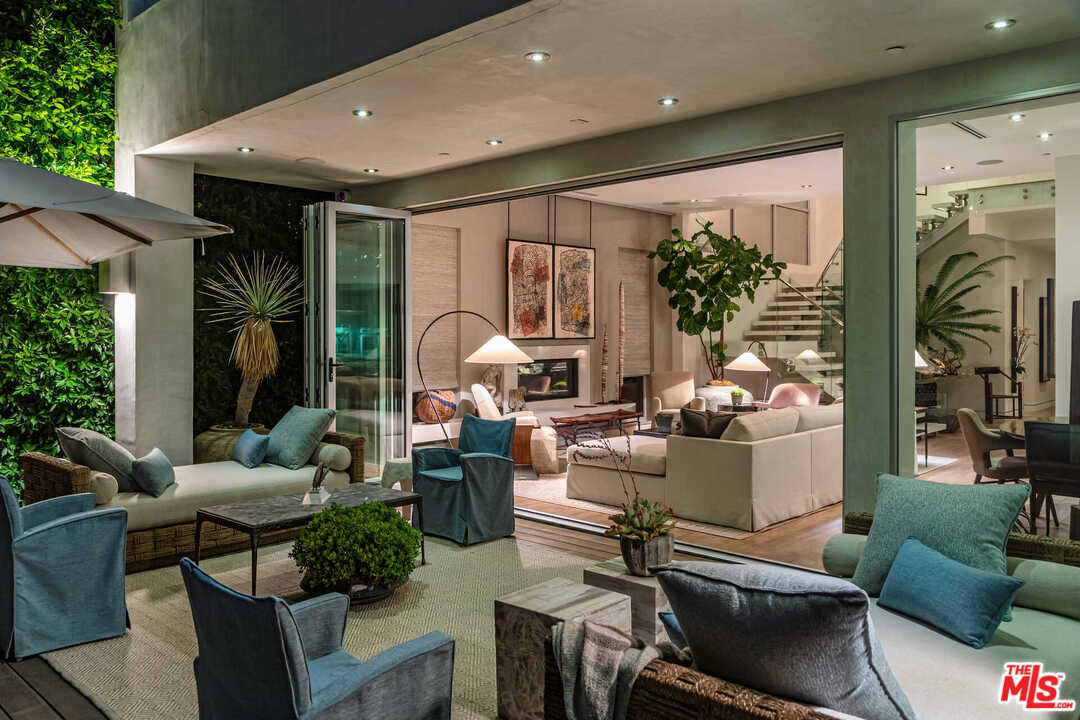 6236 Drexel Avenue Los Angeles, CA 90048 - Photo 5 of 33 a living room with furniture and a floor to ceiling window