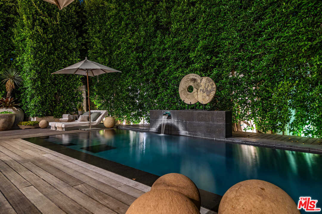 6236 Drexel Avenue Los Angeles, CA 90048 - Photo 6 of 33 a view of a swimming pool with a outdoor seating