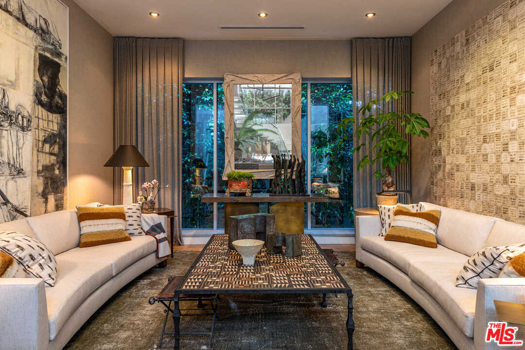 6236 Drexel Avenue Los Angeles, CA 90048 - Photo 9 of 33 a living room with furniture and a large window