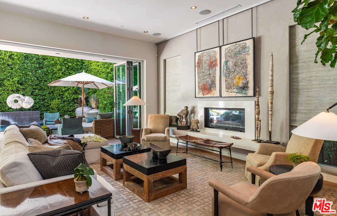 6236 Drexel Avenue Los Angeles, CA 90048 - Photo 10 of 33 a living room with furniture and a large window