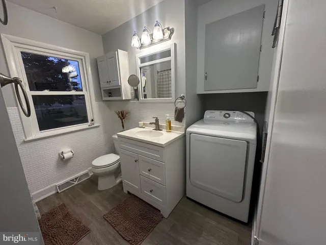 a utility room with dryer and washer