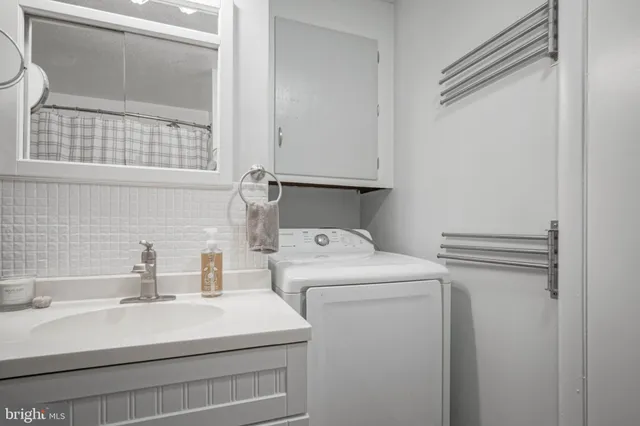 a bathroom with a sink and a shower