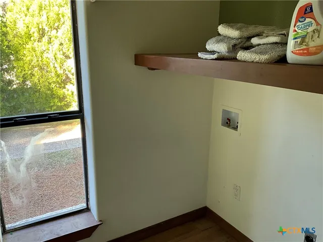 a view of a small space with wooden floor