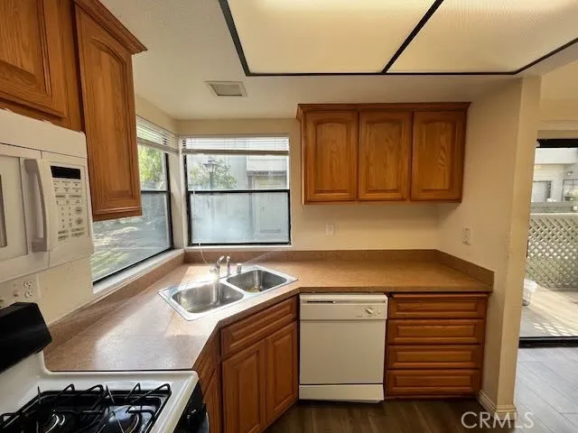 a kitchen with a refrigerator a stove and cabinets