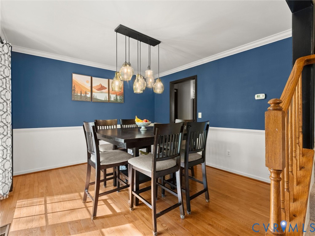 126 Reedy Creek Road Louisa, VA 23093 - Photo 17 of 68 Dining area featuring hardwood floors, a two-tone