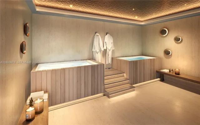 a view of a livingroom with wooden floor and a large window