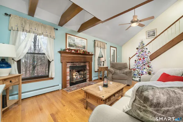 a living room with furniture and a fireplace