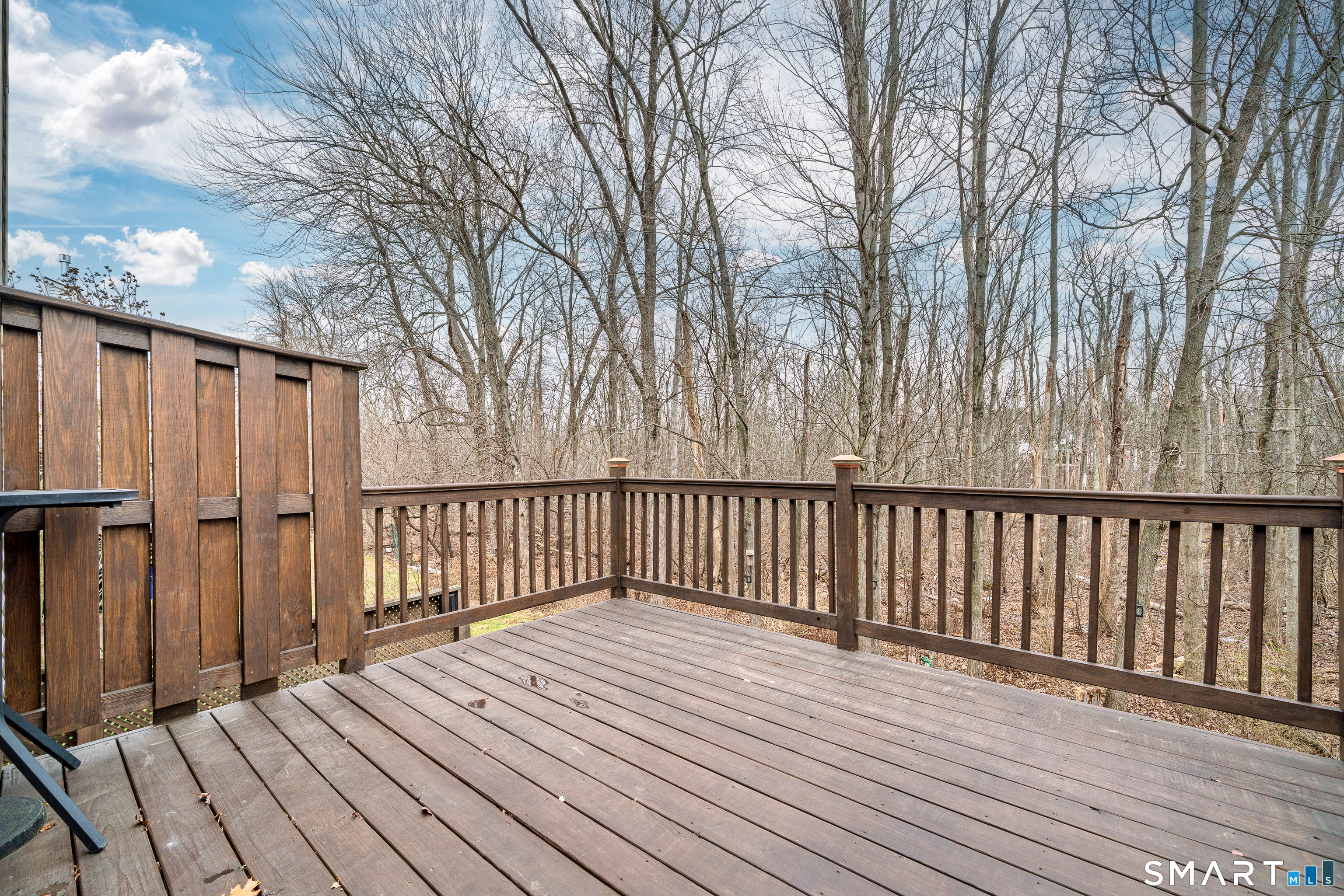 19 Tanner Crossing, Unit 19 Wethersfield, CT 06109 - Photo 34 of 40 Raised Deck overlooking yard and woods
