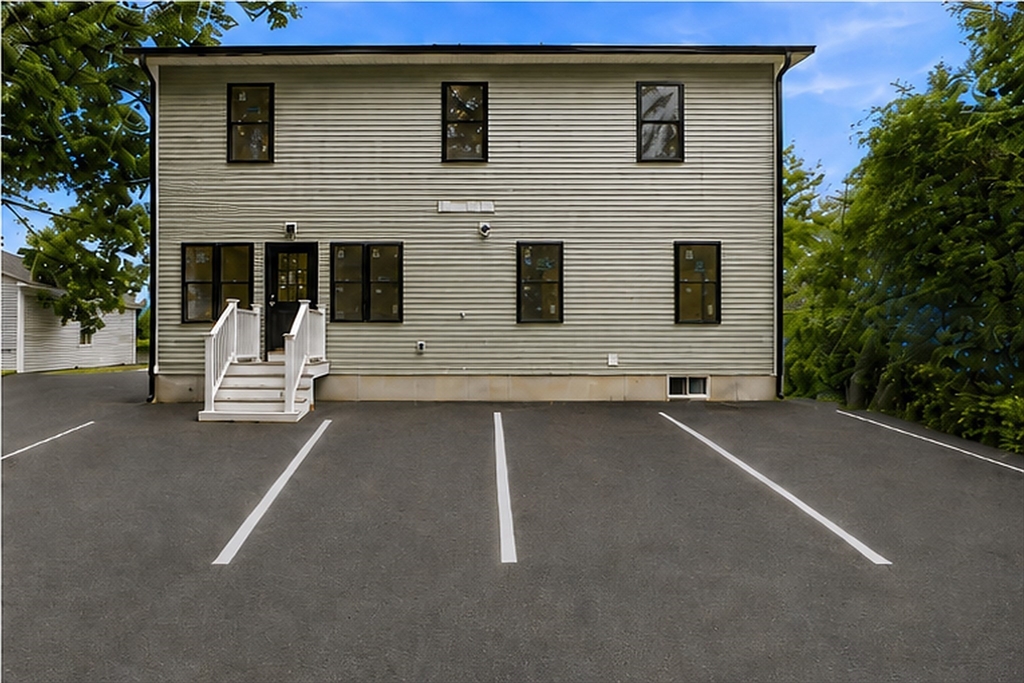 4 Mayhew Street Framingham, MA 01702 - Photo 3 of 42 a view of a house with a street